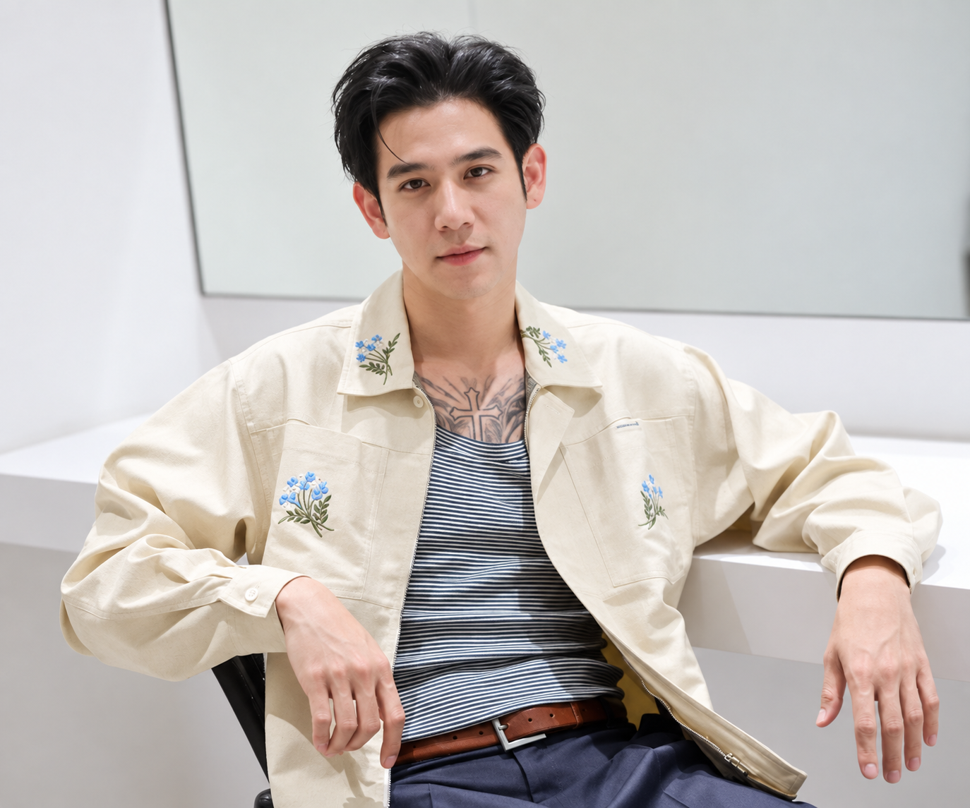 Porshe Saran seated in a light-colored shirt